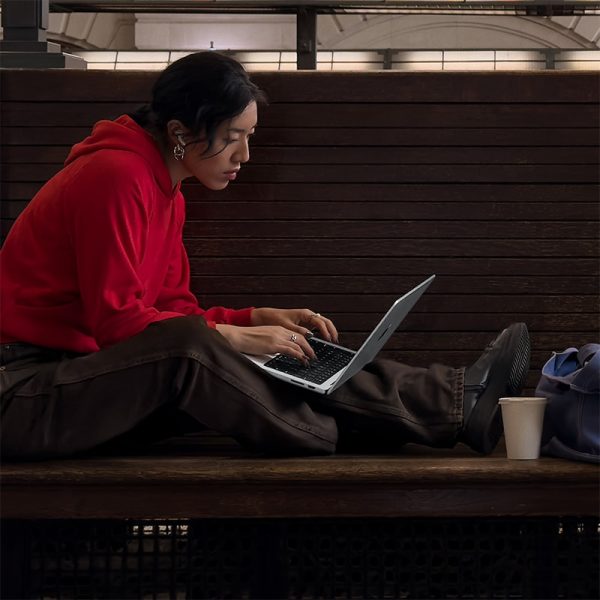 gentleman typing on macbook pro 14 inch computer