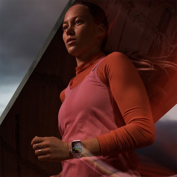 woman wearing Apple Watch Series 9 light pink